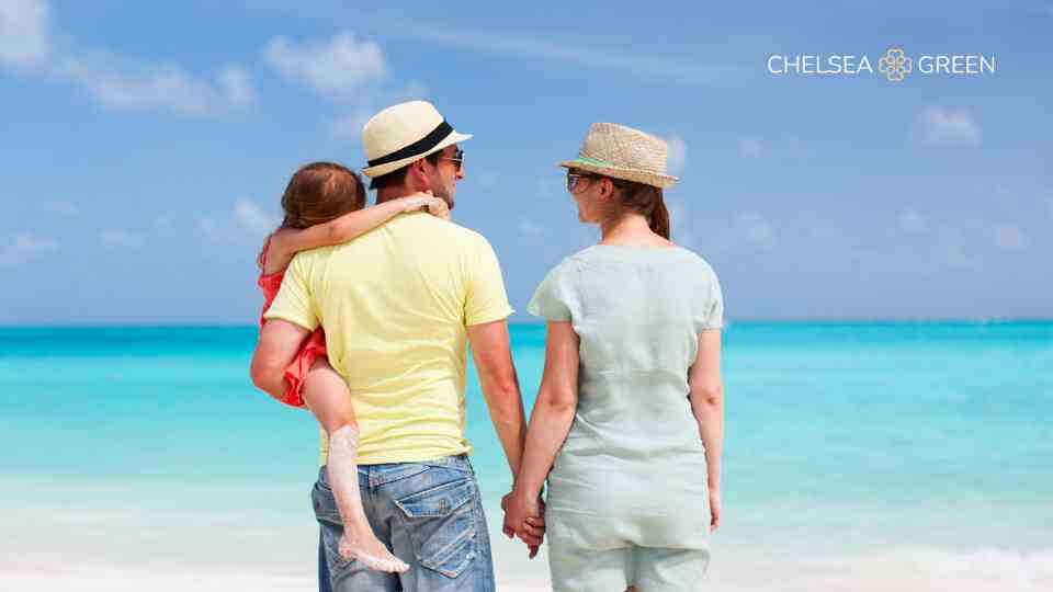 Family enjoying beach holiday after vaccination