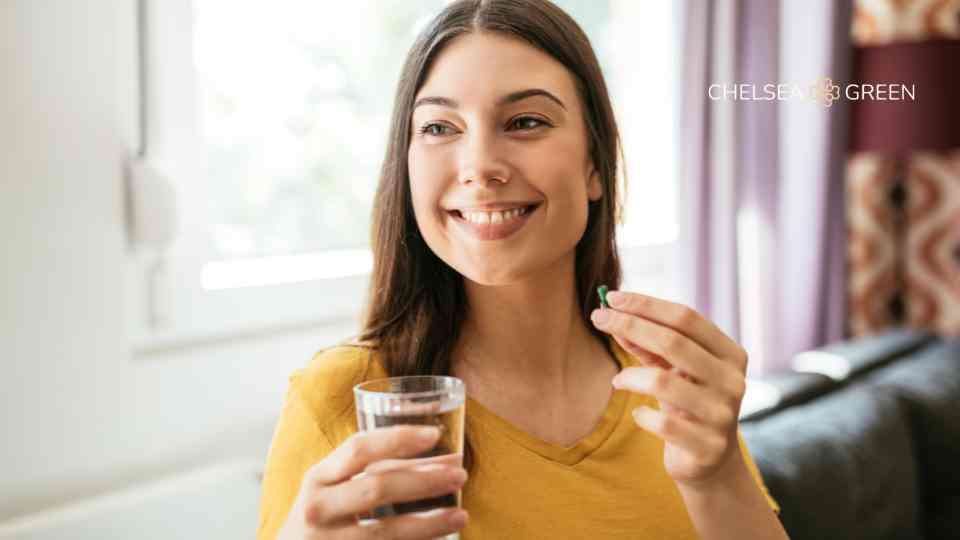 A woman taking supplements