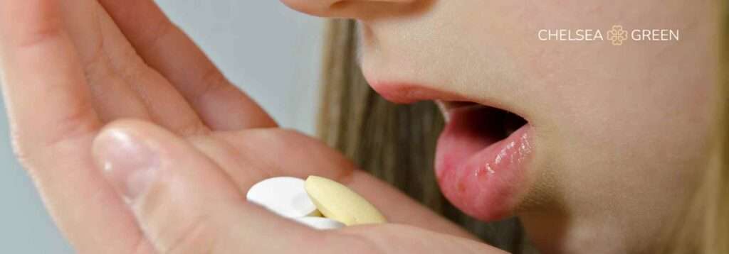Child taking motion sickness tablet