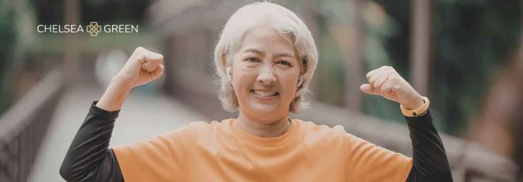 Elderly woman flexing and enjoying exercise