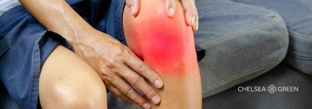 Man holding his sore knee