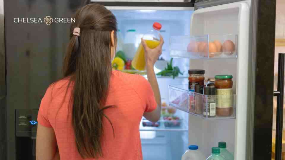 Woman accessing food or weight loss medication in the fridge