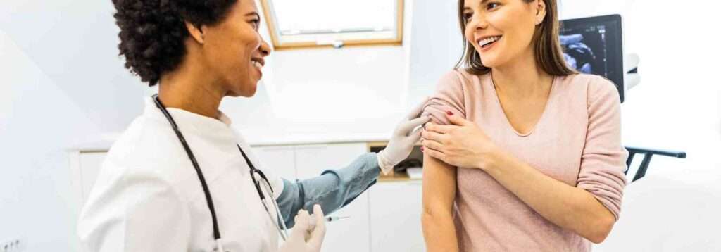 A woman happy to get a travel vaccine