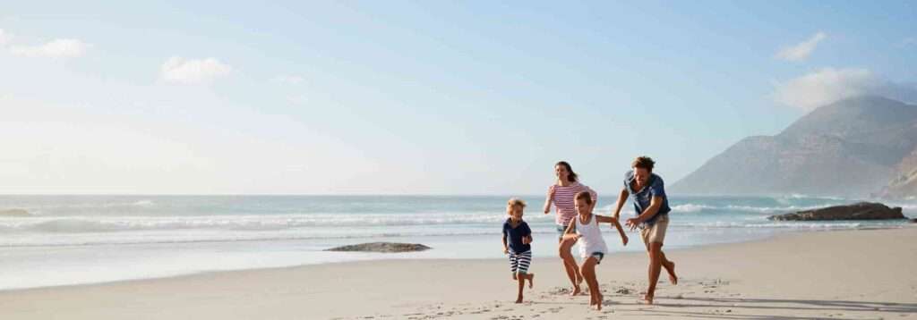 Family enjoying a safe beach holiday