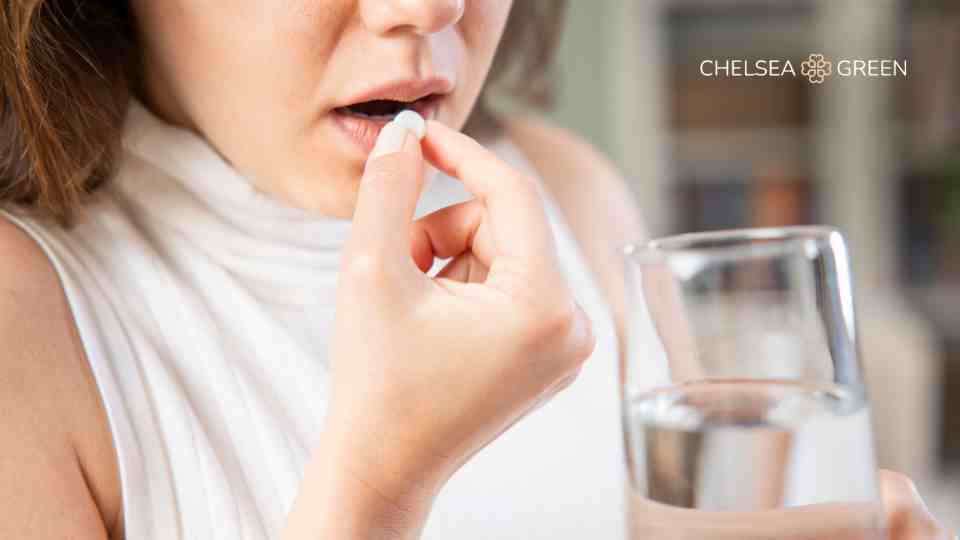 Woman taking Dukarol tablet to stop cholera