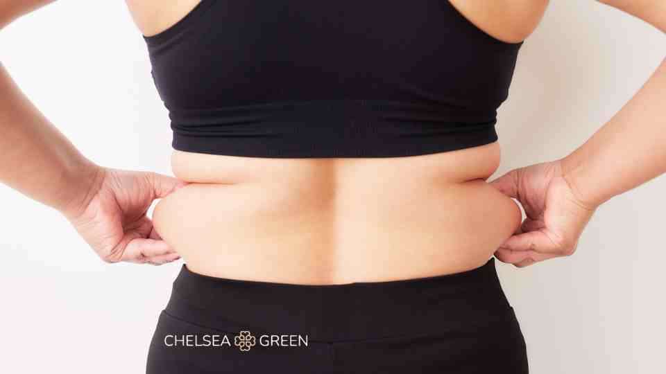 Woman holding love handles