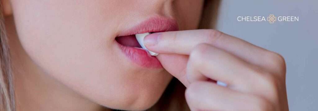 Woman taking a weight loss pill